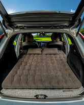 Canodoky SUV air mattress headboard setup offers adaptive comfort for long drives.