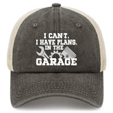 Front view of charcoal cotton front panel with beige mesh back and white text on the hat