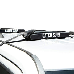 Catch Surf Surf Rack Single Black main view showing secure soft mounting for car transport.
