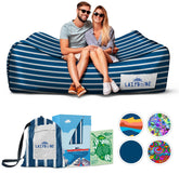 Chillbo Lazybone inflatable couch on beach enables quick relaxation between activities.