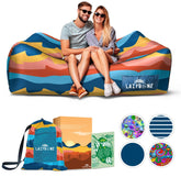 Chillbo LazyBone inflatable couch setup demonstrates quick inflation for beach or festival lounge.