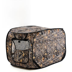 Chunm dog blind weed-print camouflage blends into field terrain for duck hunting.