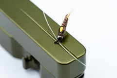 Cling Mag Grab Rod Rack clip attaches securely to waders for ready lures.