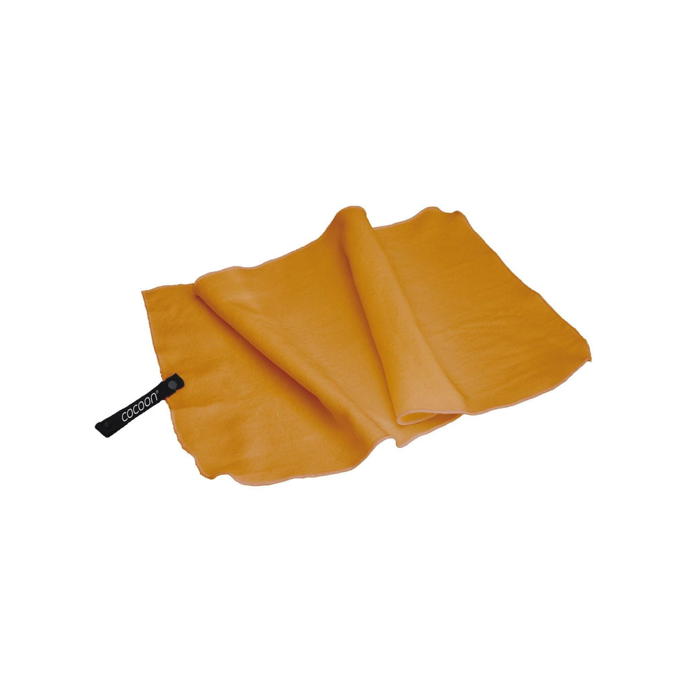 COCOON Hyperlight Towel Sunrise Small rolled for ultra-compact packing and travel convenience.