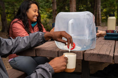 Coghlan's collapsible water container folded empty fits in a backpack