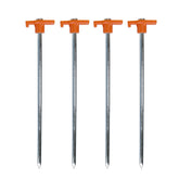 Coghlan's steel nail pegs 10-inch in use stabilizing a tent on rocky ground.
