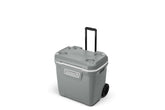 Coleman 316 Series 65-Quart wheeled cooler outdoors for easy transport