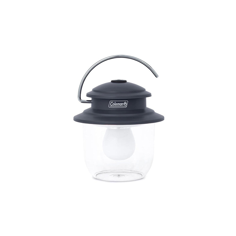Coleman Classic LED Lantern on a table providing bright campsite lighting up to 300 lumens.