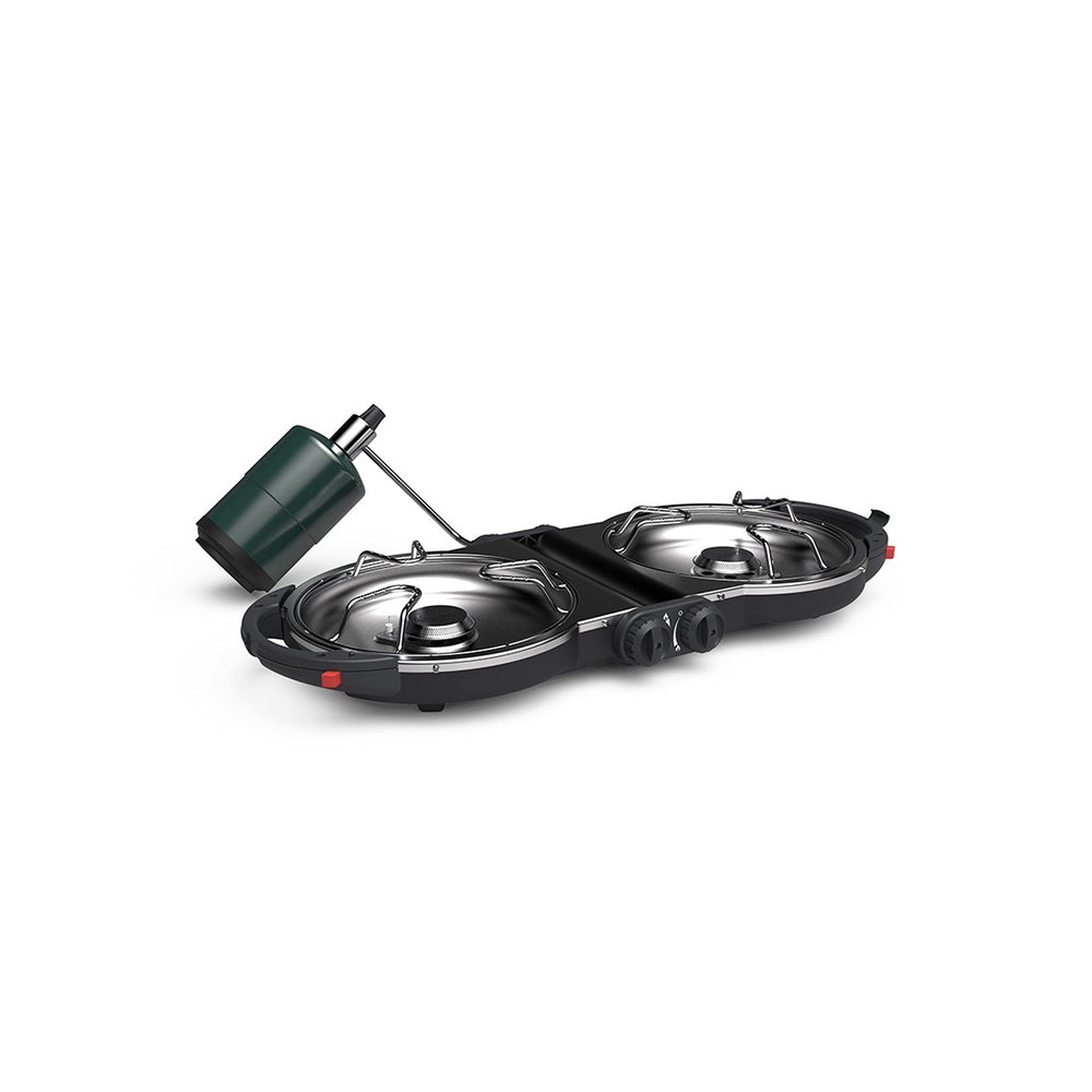 Coleman Fold N Go stove in compact folded form for portable campsite setup.