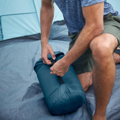 Coleman Kompact stuff sack with cinch straps compresses the bag for easy carry.