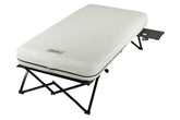 Coleman queen-size airbed cot setup for elevated camping sleep.