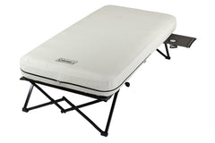 Coleman queen-size airbed cot setup for elevated camping sleep.