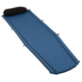 Coleman Silverton self-inflating sleeping pad rolled for compact packing and transport.