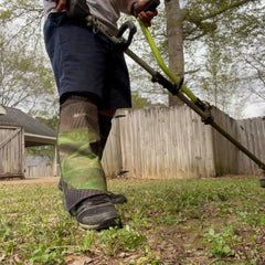 Side view of ComfortTrim leg guards in use during trimming tasks