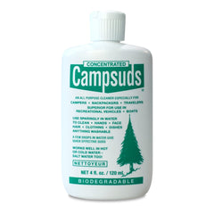 Concentrated Campsuds bottle pour in a travel-size container for quick hand and dish cleaning.