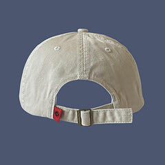 CORIRESHA cap side profile highlights the adjustable strap for a secure, comfortable fit.