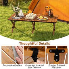Costway table with cross legs showing stability on uneven ground