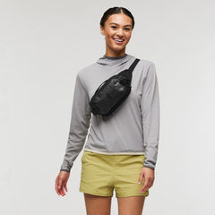 Cotopaxi Allpa X 1.5L hip pack side straps highlight secure compression for packing stability.