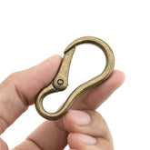 CraftMemore 2pcs carabiner snap hook in antique brass for secure gear attachment.