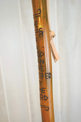 CreationCarvings hardwood walking stick showing adjustable height for a personalized fit.