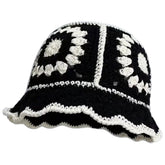 Black crochet bucket hat for women with floral knitted pattern, close-up