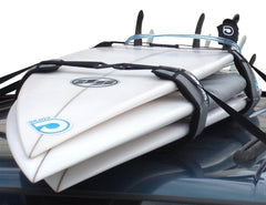 Curve Lockdown system on car roof cocooning surfboards for secure transport.
