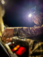 Cyclops headlamp showing white, green, and red LEDs for versatile signaling.