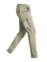 Cycorld men's hiking pants water-resistant fabric on rugged trail for splashes and light rain protection.