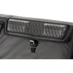 Dakine pad shows adjustable webbing anchor straps for secure fit