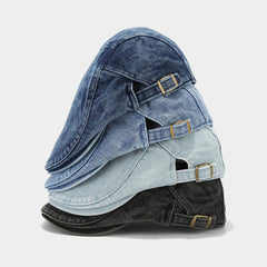 Model wearing denim newsboy cap during outdoor activity