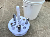 Dev Fishing 12-rod holder with bucket separator keeps rods organized on deck.