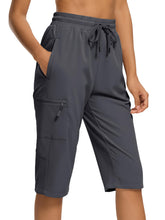 DEVOROPA women's hiking long shorts in gray with zipper pockets for secure outdoor storage.