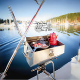 Dickinson Sea-B-Que Large side view on deck, durable marine-grade stainless.