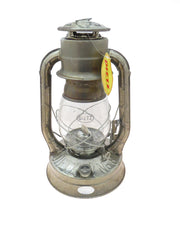Dietz #8 Air Pilot lantern with rusty finish boosts vintage campsite appeal.