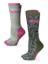 Drake Waterfowl women's camo pink merino midweight crew socks on feet with boots for outdoor adventures.