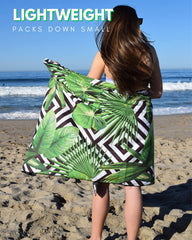ECCOSOPHY oversized towel provides ample lounging space for sunbathing.