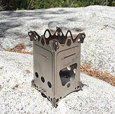 Emberlit FireAnt stove fully flat pack, ideal for ultralight backpacking.