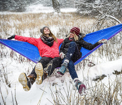 ENO DoubleNest hammock setup in the woods using compatible ENO straps.
