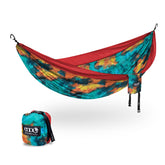 ENO DoubleNest tie-dye red setup showing easy relaxation under color-rich shade