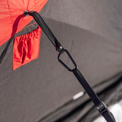 Cam straps with carabiners provide quick, reliable tensioning for shelter stability.