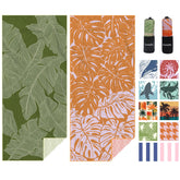 Eunzel palm-pattern towel on sand highlights quick-dry beach comfort.