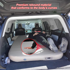 EVbase-ev air mattress with two adults on bed during a road trip.