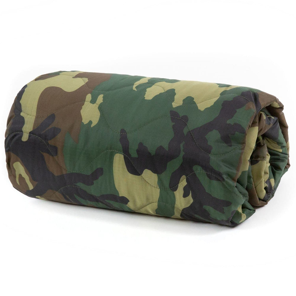 Farm Blue Jungle Camo blanket folded in its drawstring bag for easy camping setup.