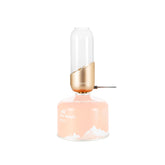 Fire-Maple orange camping lantern glass globe emits warm glow for outdoor ambiance.