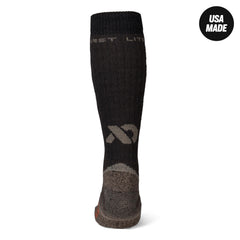First Lite merino OTC socks, heel detail, cushioning emphasized.
