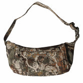 First Lite Thermic Muff, front view in camo, showcases windproof warmth for hunts.