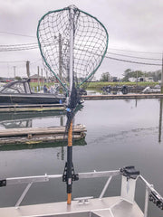 Fish Fighter Net Holder mounted to rail slider for secure storage and quick retrieval.