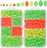 Assorted glow-in-the-dark fishing beads in green, yellow and red colors.