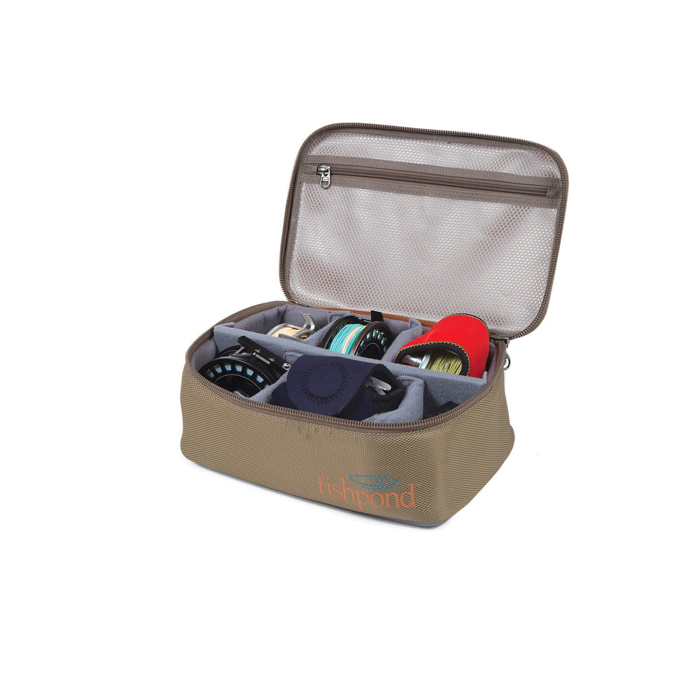 fishpond Ripple Reel Case front view in sand, protecting reels during travel