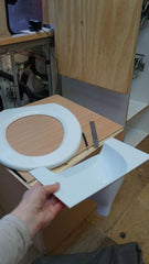 Free Range Designs urine diverter dry-solid-waste shows dry, odor-reducing solid waste.
